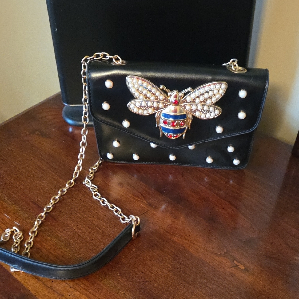 Black Designer Bag with Gold Chain and Bee Embellishment